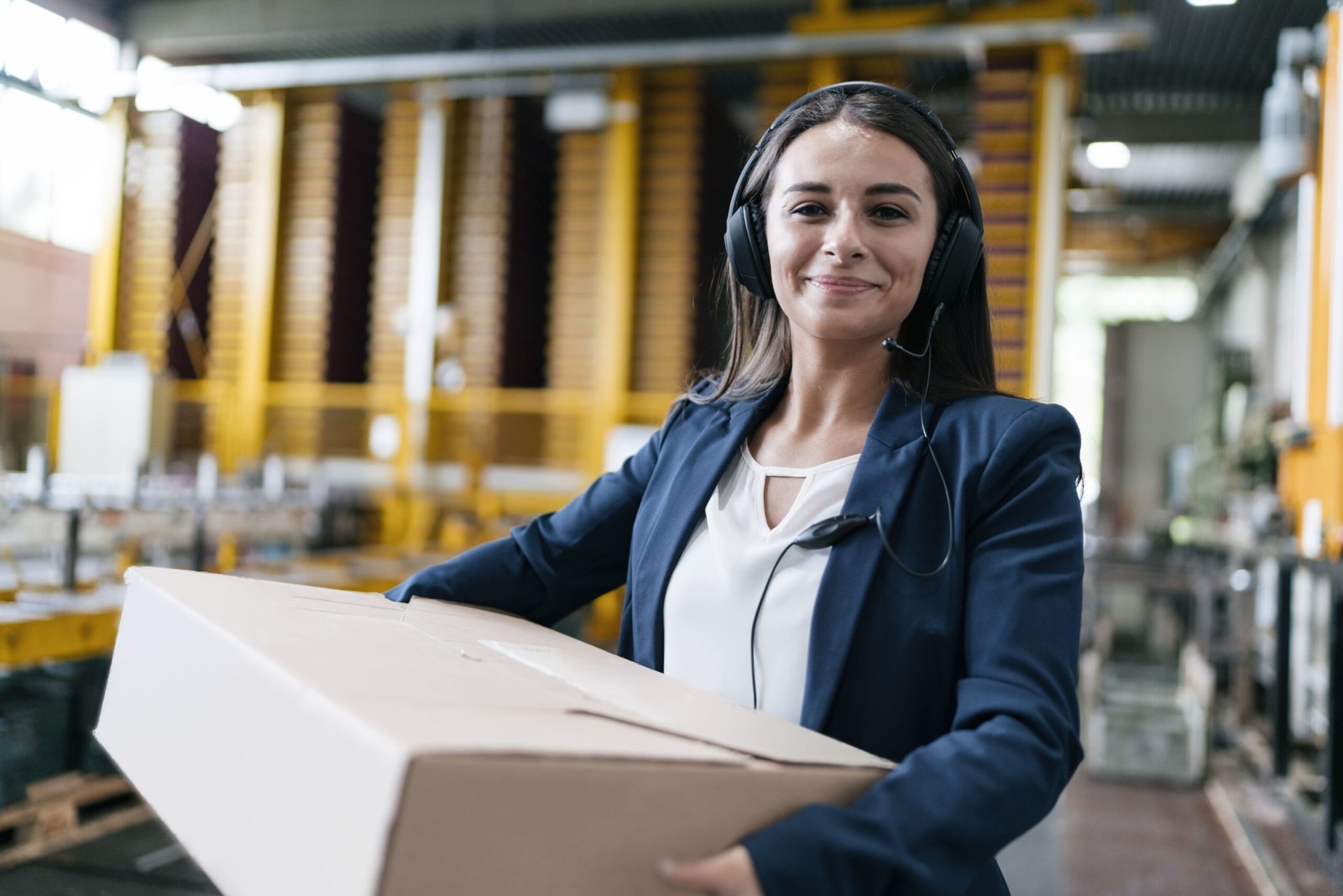 young-woman-working-at-parcel-service-carrying-pa-2024-09-22-14-59-48-utc